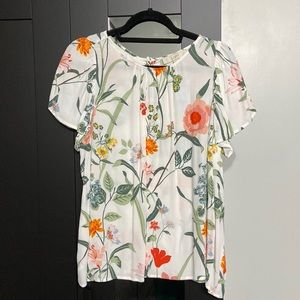 NWT White floral blouse with a button down back.